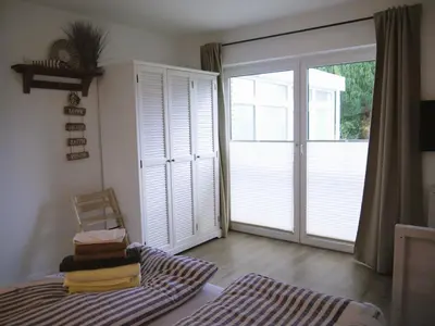 Ein Bett oder Betten in einem Zimmer der Unterkunft Ferienhaus Haffliebe