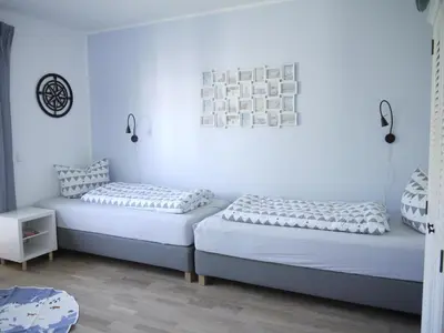 Ein Bett oder Betten in einem Zimmer der Unterkunft Ferienhaus Haffliebe