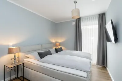 Ein Bett oder Betten in einem Zimmer der Unterkunft Sturmfrei Suite 8