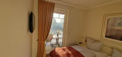 Ein Bett oder Betten in einem Zimmer der Unterkunft Moderne Kurparkresidenz