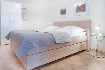 Ein Bett oder Betten in einem Zimmer der Unterkunft Haus Eva Mar am Meer Appartement 7