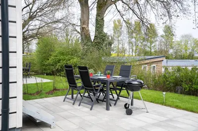 Ein Garten an der Unterkunft Ostseecamp Ferienhaus 