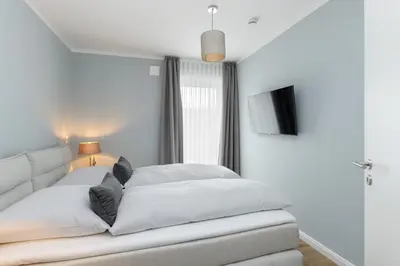 Ein Bett oder Betten in einem Zimmer der Unterkunft Sturmfrei Suite 4