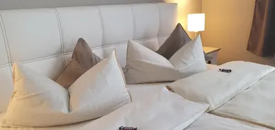Ein Bett oder Betten in einem Zimmer der Unterkunft Hotel Atlantic Travemünde