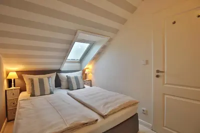 Ein Bett oder Betten in einem Zimmer der Unterkunft Am Kardohr 5 Appartement Weitblick