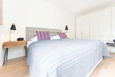 Ein Bett oder Betten in einem Zimmer der Unterkunft Priwalk Vacation