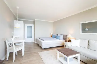 Ein Bett oder Betten in einem Zimmer der Unterkunft Ferienwohnung Residenz App 149 - Timmendorfer Strand
