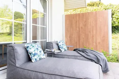 Ein Sitzbereich in der Unterkunft Ferienwohnung Infinity Garden - Scharbeutz