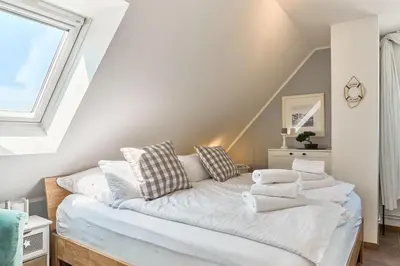 Ein Bett oder Betten in einem Zimmer der Unterkunft Gorch-Fock-Str 31 Kajüte31