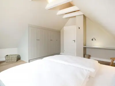 Ein Bett oder Betten in einem Zimmer der Unterkunft Strandheimat