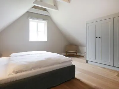 Ein Bett oder Betten in einem Zimmer der Unterkunft Strandheimat