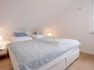 Ein Bett oder Betten in einem Zimmer der Unterkunft 3 Meeresperlen Strandhaus
