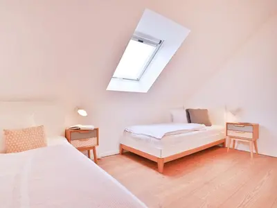Ein Bett oder Betten in einem Zimmer der Unterkunft 3 Meeresperlen Strandhaus