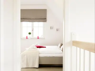 Ein Bett oder Betten in einem Zimmer der Unterkunft Roter Milan