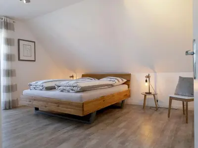 Ein Bett oder Betten in einem Zimmer der Unterkunft Kapitänshaus