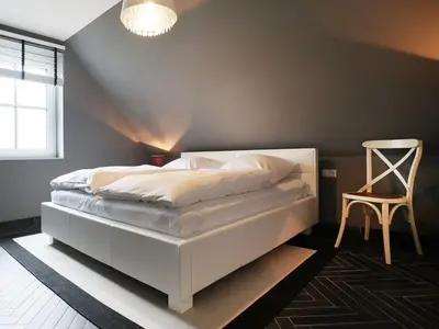 Ein Bett oder Betten in einem Zimmer der Unterkunft Jolle Ferienhaus