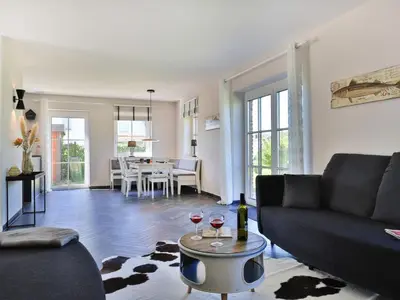 Ein Sitzbereich in der Unterkunft Jolle Ferienhaus