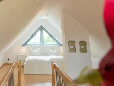 Ein Bett oder Betten in einem Zimmer der Unterkunft Strandlust