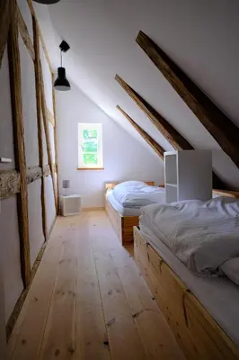 Ein Bett oder Betten in einem Zimmer der Unterkunft Gutshaus KVH FeWo Brook
