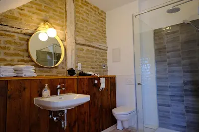 Ein Badezimmer in der Unterkunft Gutshaus KVH FeWo Warnemünde