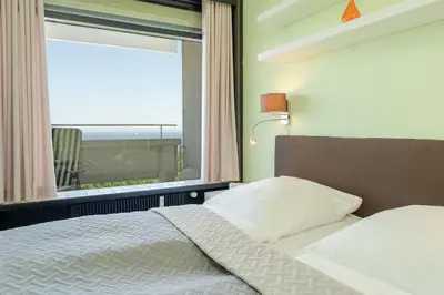 Ein Bett oder Betten in einem Zimmer der Unterkunft Panoramic Panoramablick Ostsee