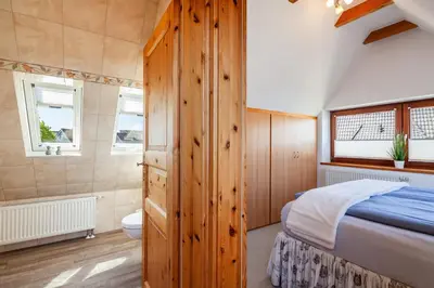 Ein Bett oder Betten in einem Zimmer der Unterkunft Gästehaus Annabel