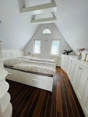 Ein Bett oder Betten in einem Zimmer der Unterkunft Das Torhaus