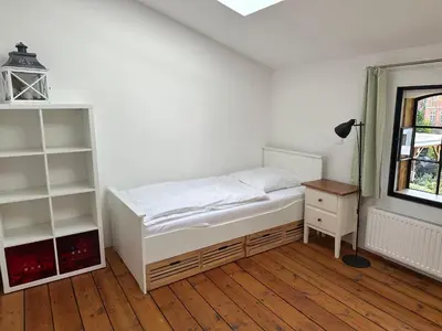 Ein Bett oder Betten in einem Zimmer der Unterkunft Urlaub in Einer Historischen Wassermühle an der Trave