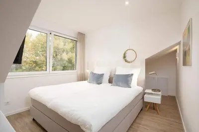 Ein Bett oder Betten in einem Zimmer der Unterkunft SEASIDE - Neubau mit Meeresblick
