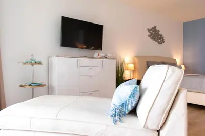 Ein Bett oder Betten in einem Zimmer der Unterkunft Ferienwohnung Kaiserperle Travemünde