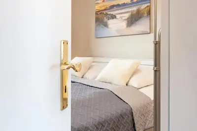 Ein Bett oder Betten in einem Zimmer der Unterkunft Strandburg Ostseeblick Scharbeutz