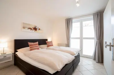 Ein Bett oder Betten in einem Zimmer der Unterkunft Seesand Nr 4