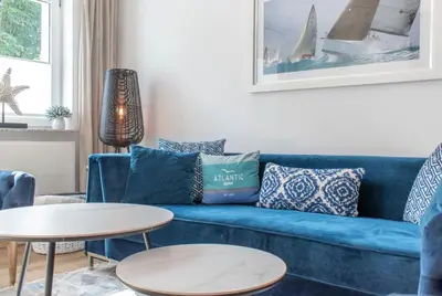 Ein Sitzbereich in der Unterkunft Ferienhaus Das Kleine Strandhaus Scharbeutz