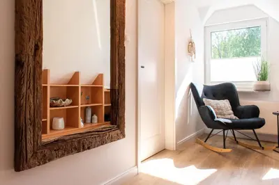 Ein Sitzbereich in der Unterkunft Ferienhaus Das Kleine Strandhaus Scharbeutz
