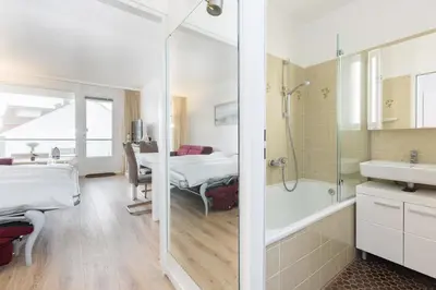 Ein Bett oder Betten in einem Zimmer der Unterkunft Ferienwohnung Meeresstrand, App 304