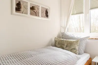 Ein Bett oder Betten in einem Zimmer der Unterkunft Ferienwohnung Strandleben