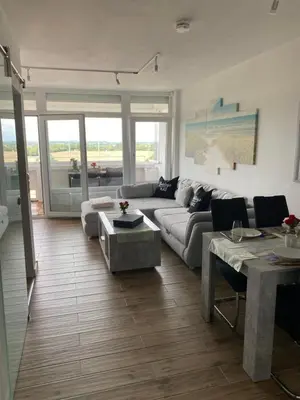 Ein Sitzbereich in der Unterkunft Ferienwohnung Lieblingsplatz, Urlaub und Meer!