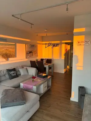 Ein Sitzbereich in der Unterkunft Ferienwohnung Lieblingsplatz, Urlaub und Meer!