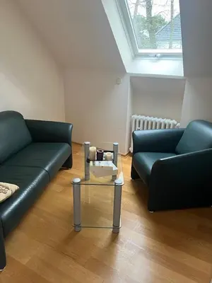 Ein Sitzbereich in der Unterkunft Dünenhaus Zimmer