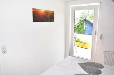 Ein Bett oder Betten in einem Zimmer der Unterkunft Seeadler Ferienwohnung