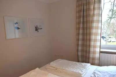Ein Bett oder Betten in einem Zimmer der Unterkunft Seepassage Ferienwohnung Nr 02