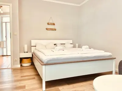 Ein Bett oder Betten in einem Zimmer der Unterkunft Wohlfühl Strand Wohnung 'Mein Ankerplatz'