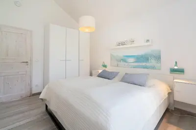 Ein Bett oder Betten in einem Zimmer der Unterkunft Strandpark Sierksdorf H026