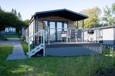 Ein Garten an der Unterkunft Ostseecamp Ferienhaus 