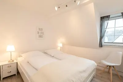 Ein Bett oder Betten in einem Zimmer der Unterkunft Meeresliebling