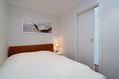 Ein Bett oder Betten in einem Zimmer der Unterkunft Ferienpark Sierksdorf App 25 - Strandlage
