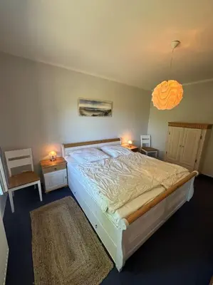 Ein Bett oder Betten in einem Zimmer der Unterkunft Altes Zollhaus direkt am Ostseestrand
