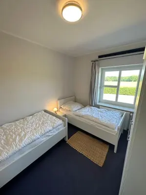 Ein Bett oder Betten in einem Zimmer der Unterkunft Altes Zollhaus direkt am Ostseestrand