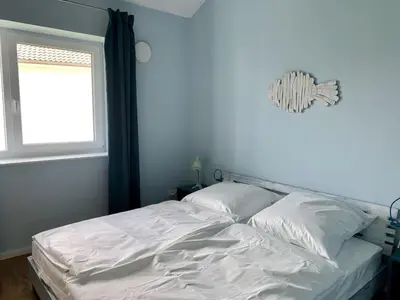 Ein Bett oder Betten in einem Zimmer der Unterkunft Ferienwohnung Seepferdchen Finnlandring