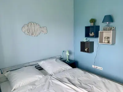 Ein Bett oder Betten in einem Zimmer der Unterkunft Ferienwohnung Seepferdchen Finnlandring